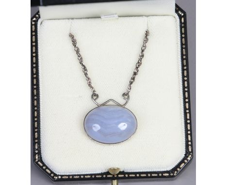 A vintage silver mounted stripped blue agate pendant on chain