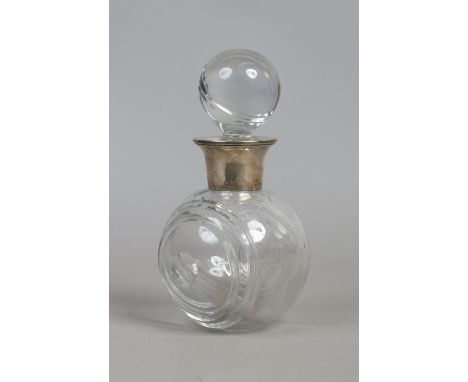 A cut glass decanter formed as a lawn bowl with silver collar, assayed Sheffield 1991