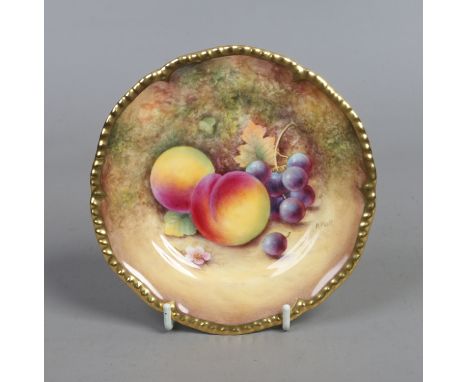 A Royal Worcester small gadrooned dish painted with fruit by P. Platt, black printed mark.