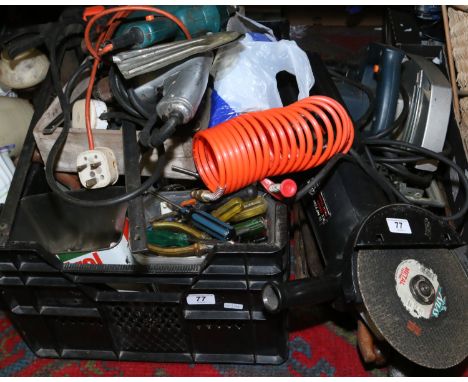 A box of assorted hand and power tools.