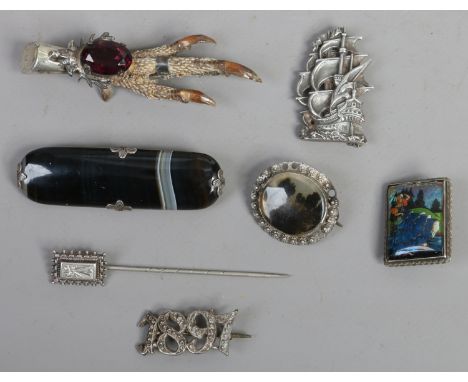 Six silver brooches and a silver stick pin including pheasants foot, moss agate and banded agate examples