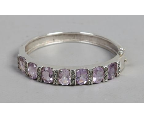 A cased silver amethyst and marcasite bangle.
