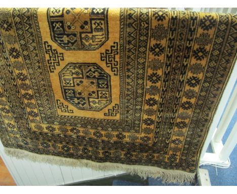 A WOOL RUG the light brown ground with overall pattern 189cm x 144cm 