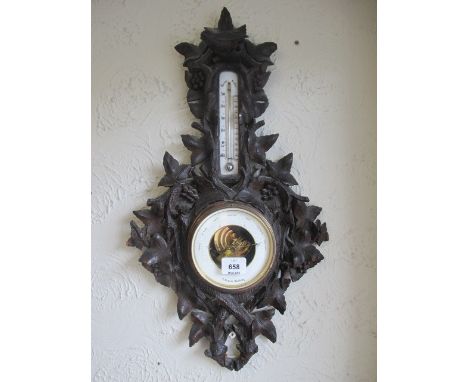 A BLACK FOREST CASED BAROMETER AND THERMOMETER inscribed "T Downie Hamburg" 62cm (h) x 35cm (w)