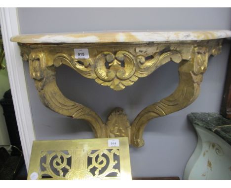 A CONTINENTAL CARVED GILTWOOD CONSOLE TABLE of demi-lune outline surmounted with a vein marble top above a C scroll frieze on