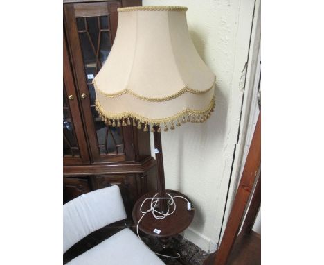 A MAHOGANY FLOOR STANDARD LAMP the reeded column joined by a circular dish raised on tripod support with shade