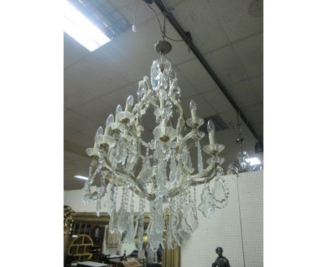 A CONTINENTAL CUT GLASS CHANDELIER hung in two registers 107cm drop