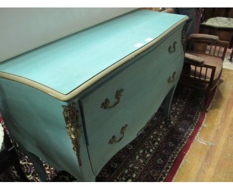 A CONTINENTAL BLUE PAINTED AND PARCEL GILT COMMODE of bombe outline the shaped moulded top above two frieze drawers between p