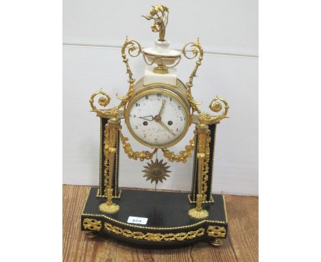 A VERY FINE 19TH CENTURY FRENCH GILT BRASS AND MARBLE MANTLE CLOCK surmounted with neo classical urn issuing floral spray the