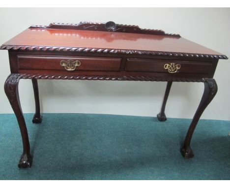 A CHIPPENDALE STYLE MAHOGANY SIDE TABLE the rectangular top with gadrooned rim above two frieze drawers on cabriole legs with