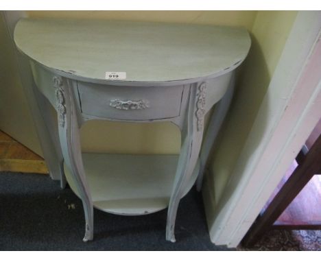 A CONTINENTAL BLUE PAINTED SIDE TABLE of demi-lune outline the shaped moulded top above a frieze drawer on cabriole legs join