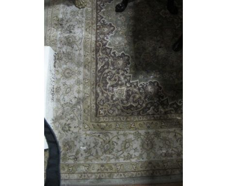 A WOOL RUG the light green ground with overall floral decoration 236cm x 158cm