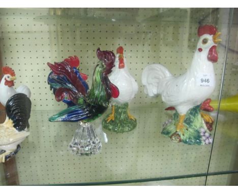 A MISCELLANEOUS COLLECTION ON THREE SHELVES to include China and glazed figures modelled as hens, vases, mahogany case with m