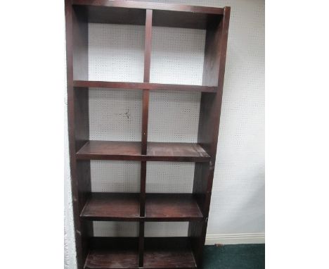 A FOUR TIER OPEN FRONT SHELF containing eight compartments 204cm (h) x 100cm (w) x 41cm (d)