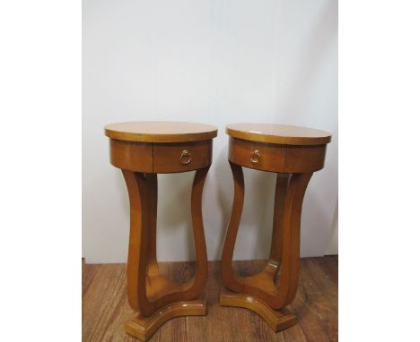 A PAIR OF ART DECO STYLE BURR WALNUT LAMP TABLES each of circular form with frieze drawer on shaped supports and concave plat