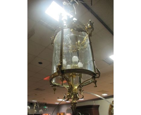 A CONTINENTAL GILT BRASS AND ENGRAVED GLASS FOUR LIGHT HALL LANTERN of cylindrical form with pierced circlet