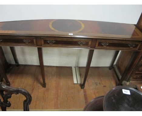 A GEORGIAN STYLE MAHOGANY SIDE TABLE the rectangular top with broad cross banding and three frieze drawers on square tapering