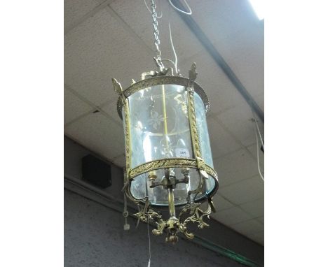 A GILT BRASS AND ENGRAVED GLASS FOUR LIGHT HALL LANTERN of cylindrical form with etched glass panels 80cm high