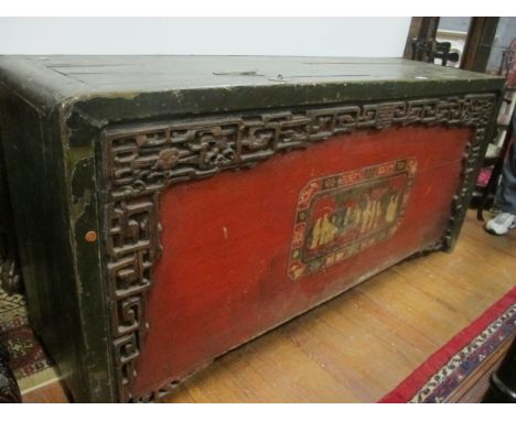 A CHINESE HARDWOOD AND POLYCHROME TRUNK of rectangular form the shaped moulded top with two lidded compartments above a pierc