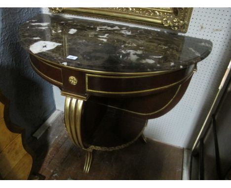 A FINE CONTINENTAL MAHOGANY GILT BRASS AND PARCEL GILT MOUNTED SIDE TABLE of demi-lune outline surmounted with a vein marble 