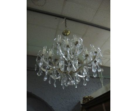 A FIFTEEN BRANCH CUT GLASS CHANDELIER hung with pendant drops 85cm drop