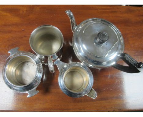 A THREE PIECE SHEFFIELD PLATED TEA SERVICE with ebonised handle 