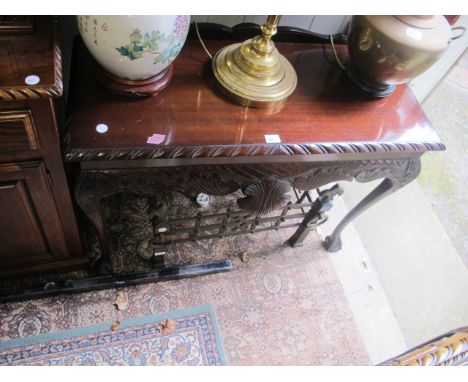 A CHIPPENDALE STYLE MAHOGANY SIDE TABLE the rectangular top with gadrooned rim above a carved frieze on cabriole legs with cl