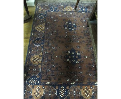 A BOKHARA WOOL RUG the light brown and indigo ground with stylized flowerheads within a three strand conforming border 183cm 