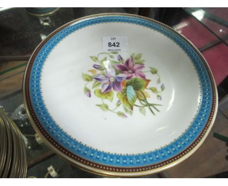 AN EIGHTEEN PIECE ROYAL WORCESTER FRUIT SET comprising seventeen side plates and comport the white ground with central floral