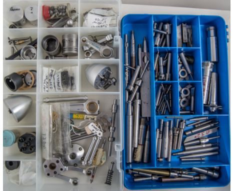 Four x plastic boxes, three containing engine spares and one with cutting tools.