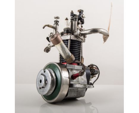 Unknown 15cc four stroke engine, with flywheel, one quick rod missing, nearly new.
