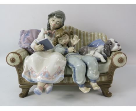 Lladro figurine Big Sister No 5735, Girl reading to small boy on a sofa with a dog. Approx 6.5" tall &amp; 9" long.