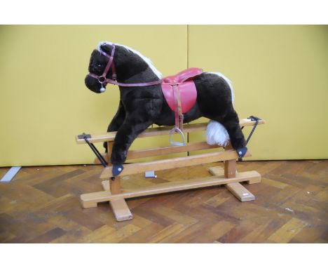 Vintage Plush rocking horse on wood frame. H:30 inches. See photos. 