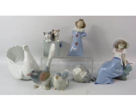 Three Nao, Two Lladro Figurines plus two others similar.