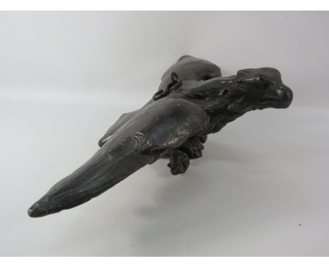 Vintage plaster eagle signed J Deville. 5" tall, 18" wide and 11" long.
