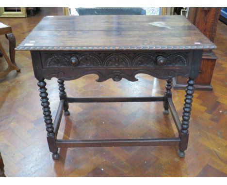 Dark Oak Gothic style Hall table with central drawer and bobbin turned legs. Measures approx H:28 x W:36 x D:23 inches. See p