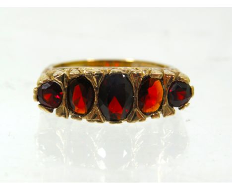 Yellow Gold Ring set with Five Graduated Garnets, the largest being 6 x 4 mm.  Finger size 'Q-5'   5.9g