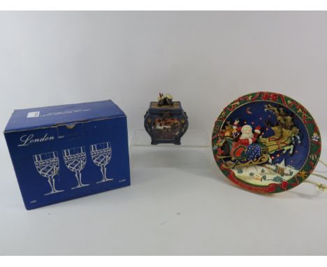 Mixed lot to include a light up christmas plate a ceramic musical trinket box and a set of Six crystal glasses.