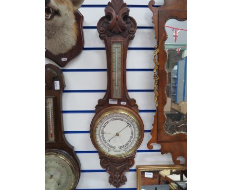  Barometer/Thermometer on Carved Oak Base. Measures approx 35 x 10 inches. See photos. 