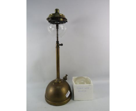 A Mid 20thC Table model tilley lamp with spare glass globe, 21" tall.