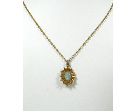 9ct Yellow Gold Opal Set pendant hung upon a 9ct 16 inch Chain. Total weight 2.2