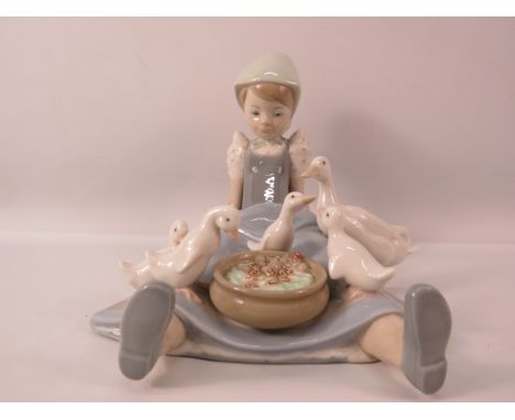 Lladro figurine of a girl with duck &amp; ducklings on her skirt " My Hungry Brood", 6.5" tall.