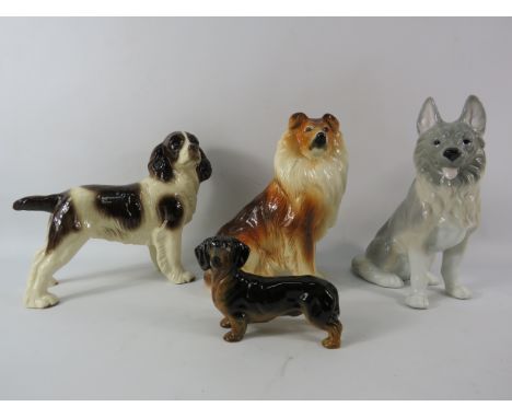 Four vintage ceramic dog figurines by Coopercraft, Royal Ashmore etc.