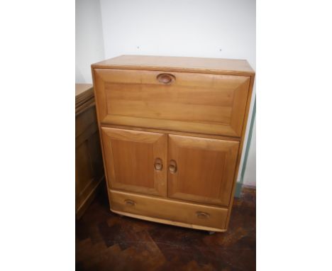 Modern Ercol Bureau with drawer and cupboard to lower section.  H:44 x W:33 x D:17 inches. In very good condition. See photos