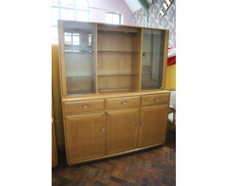 Lovely Ercol Dresser/sideboard with Illuminated top cupboards with glazed doors to sides. H:73 x W:62 x D:17 inches. In excel