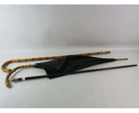 Ebony walking cane with 9ct gold top (split in the gold see pics) plus a vintage bamboo walking stick and umbrella.