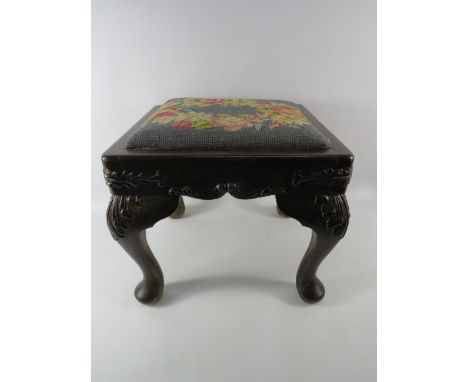Vintage wooden foot stool with embroided top, 11.5" tall, 13" wide and 12" deep.