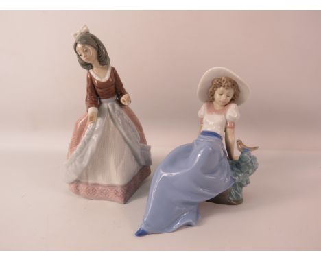 Lladro and Nao figurines of ladies.