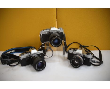 Trio of Vintage SLR Cameras by Olympus. See photos. 