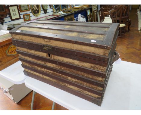 Vintage Dome topped Travel trunk with exposed lats. Hinged lid and leather carry handles in good condition. Measures approx 1